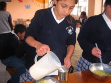 Gilda helps serve lunch in the cafeteria