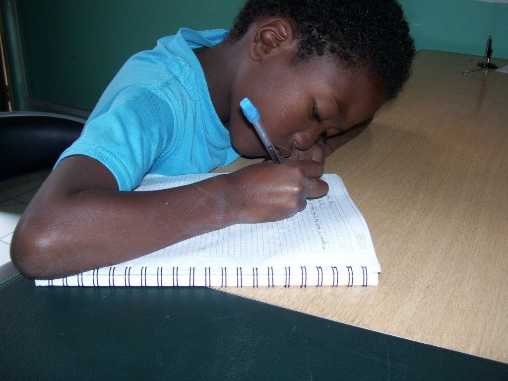 Jordan focuses on his homework at CENIT